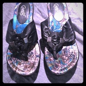 Carlos Santana black sandals with wedge heel.